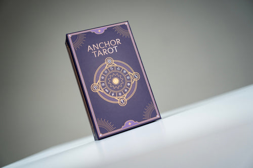Anchor Tarot deck box in purple and gold on a white display surface
